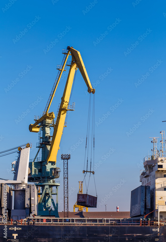 Cargo crane lifting container, Saint-Petersburg, Russia