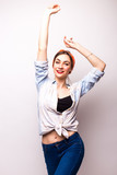 Casual style young woman, hand up. White background isolated.