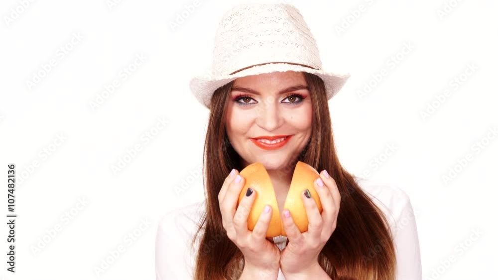 Woman holds two halfs of grapefruit citrus fruit in hands 4K Woman holds two halfs of grapefruit citrus fruit in hands 4K