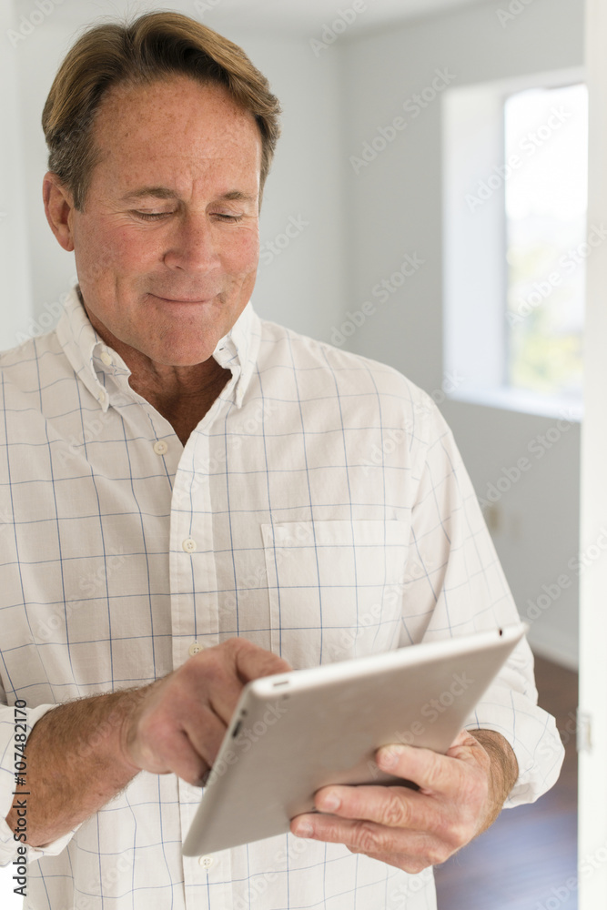 Caucasian man using digital tablet Caucasian man using digital tablet