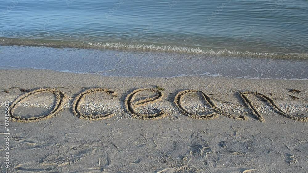 Inscription the ocean on sand, the beach. Inscription the ocean on sand, the beach.