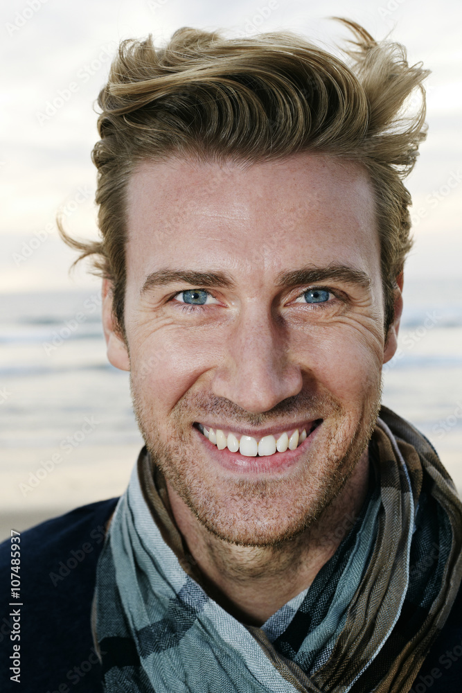 Caucasian man smiling on beach Caucasian man smiling on beach