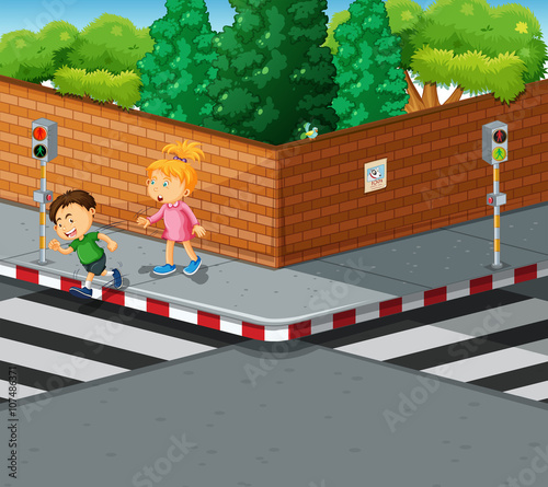Boy and girl crossing the road