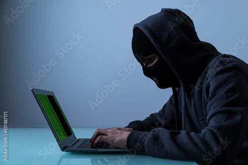 Hacker Stealing Information From Laptop