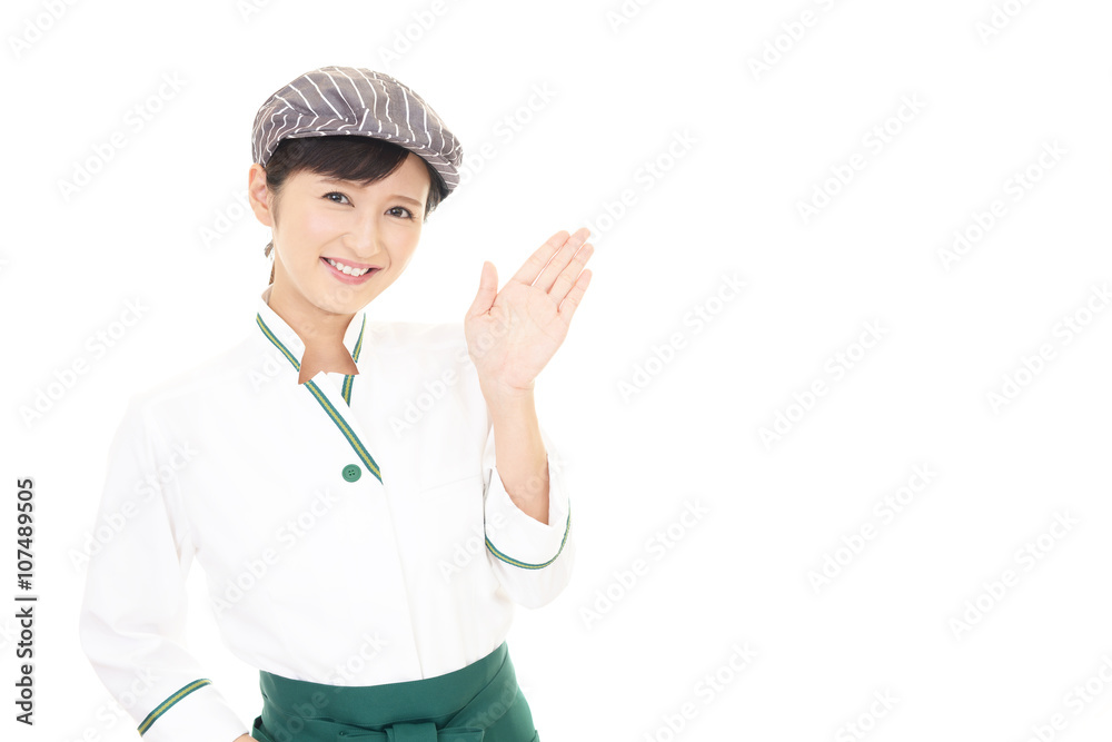 案内する笑顔のウェイトレス 案内する笑顔のウェイトレス