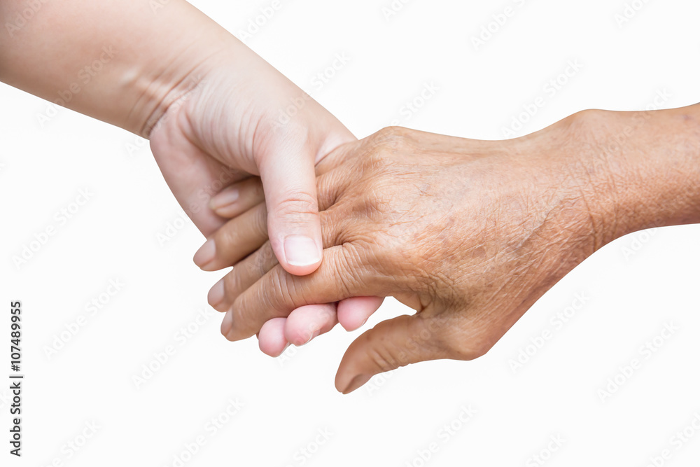 Senior and young holding Across the street hand in hand Senior and young holding Across the street hand in hand