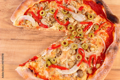 Italian vegetarian pizza on wooden surface