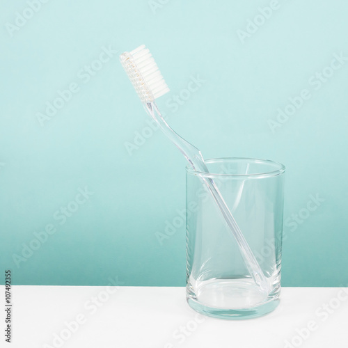 The clear toothbrush with small glass for brushing the teeth.