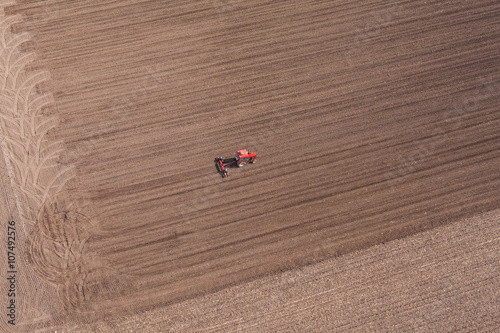 aerial view of tractor on harvest field