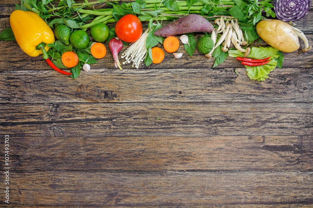 Fresh Vegetables on Wooden Background. Healthy Food. Vegetarian food, Organic Food. Vegetables on wooden table from above.