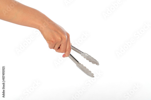 hand use tongs on white background, selective focus photo