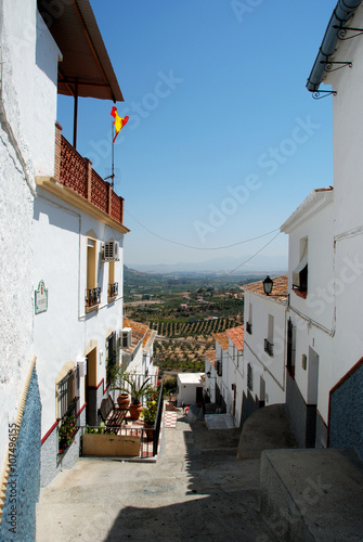 View along a town street towards the countryside  Alora  Spain.