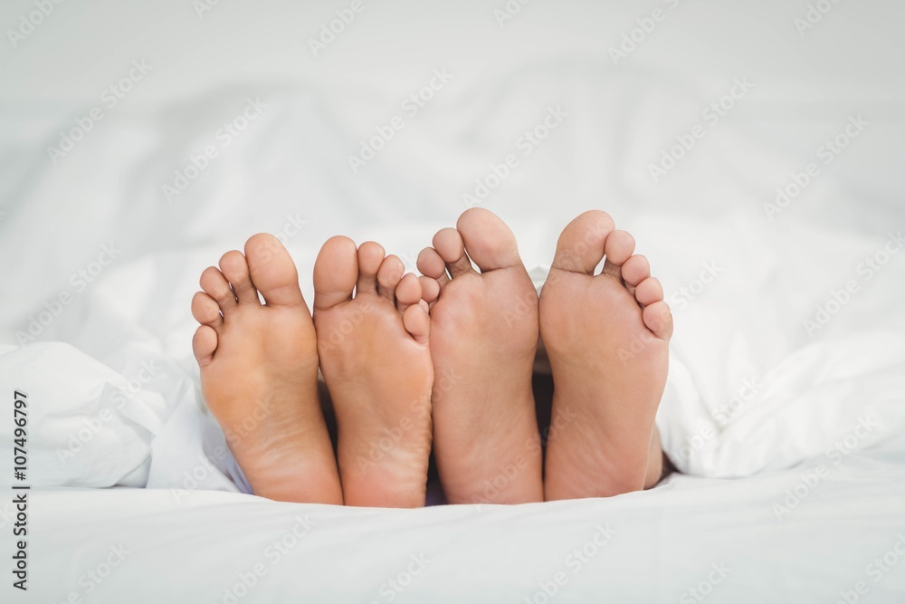 Feet sticking out from the blanket Feet sticking out from the blanket