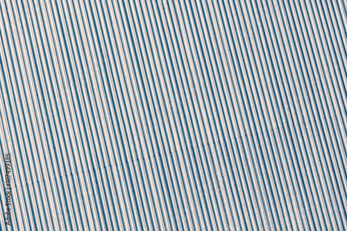 Blue toned corrugated metal roof, industrial background or textu