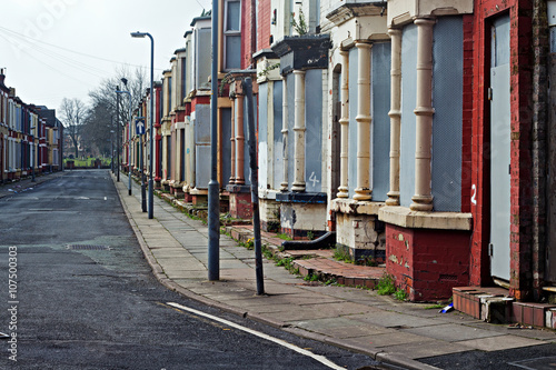 A street of boarded up derelict houses awaiting regeneration in Liverpool UK