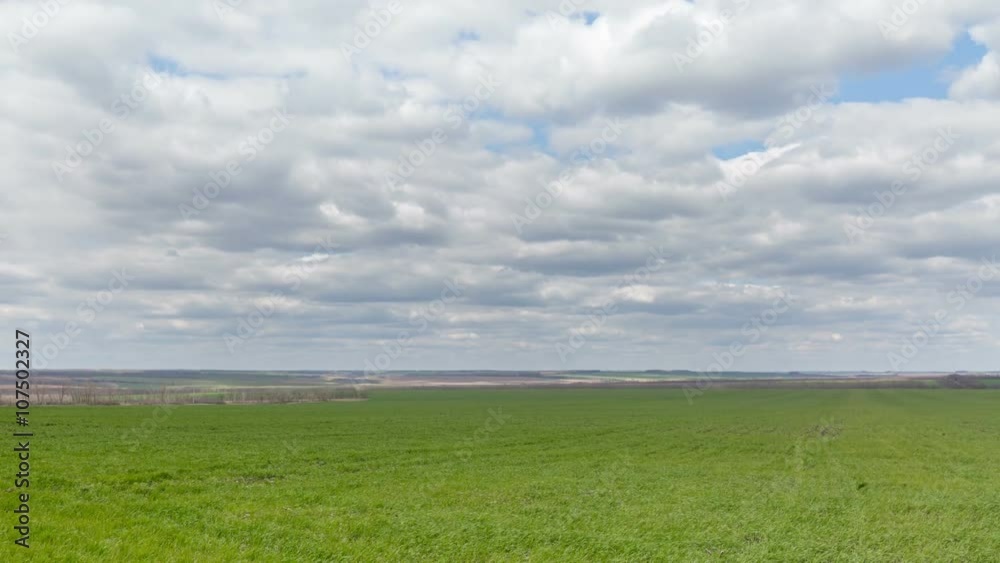 Russia, timelapse. The movement of clouds over the fields of winter wheat in early spring in the vast steppes of the Don. Russia, timelapse. The movement of clouds over the fields of winter wheat in early spring in the vast steppes of the Don.