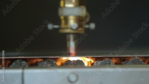 Laser cutting of metal sheet with sparks