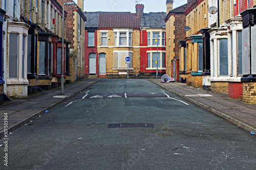 A street of boarded up derelict houses awaiting regeneration in Liverpool UK