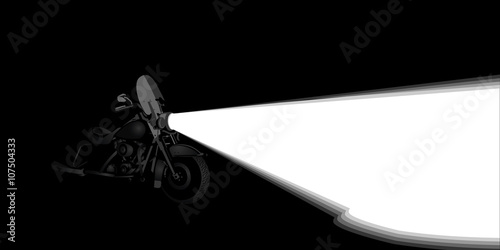 Heavy touring motorcycle headlight on a night road