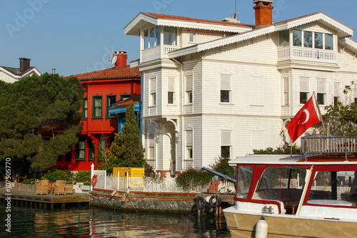 Motorboat and the historical mansion house of Bosporus in Istanbul city