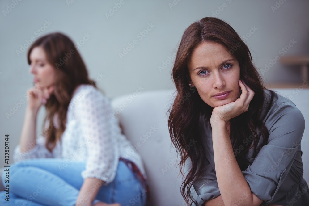 Woman ignoring her friend after an argument Woman ignoring her friend after an argument