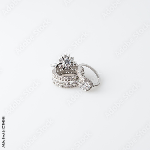 Luxury jewelry. White gold or silver rings with diamonds. Selective focus