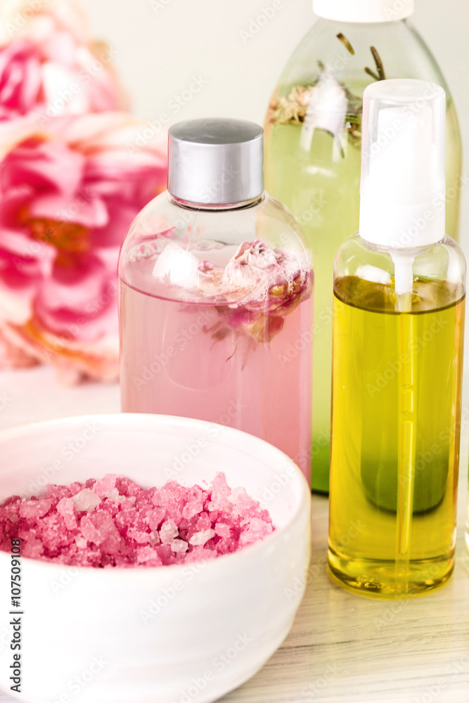 Spa setting with pink roses and aroma oil, vintage style Spa setting with pink roses and aroma oil, vintage style