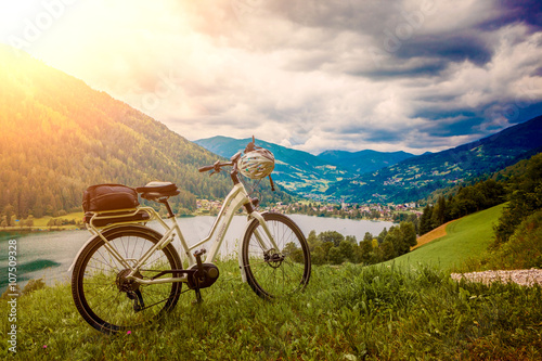 e-bike standing above a beautiful landskape with a lake - e-powe