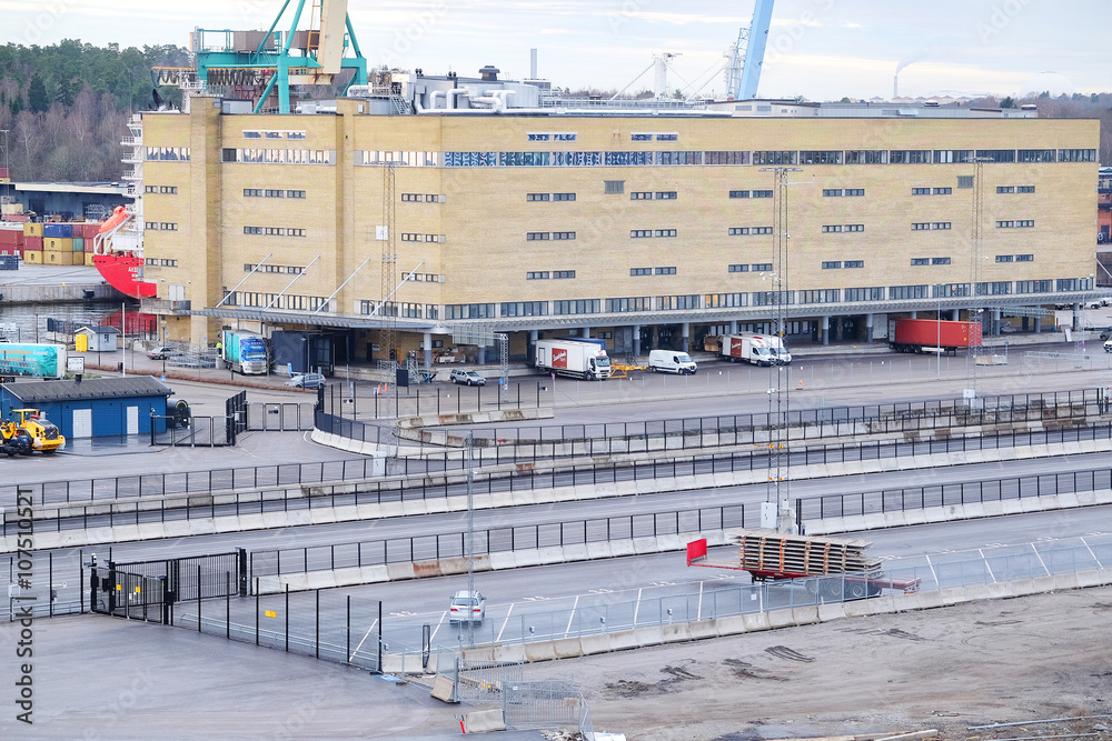 Stockholm, Sweden - March, 15, 2016: trucks on a parking in Stockholm harborn, Sweden Stockholm, Sweden - March, 15, 2016: trucks on a parking in Stockholm harborn, Sweden