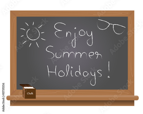 Enjoy Summer Holiday text on a school blackboard written with chalk.