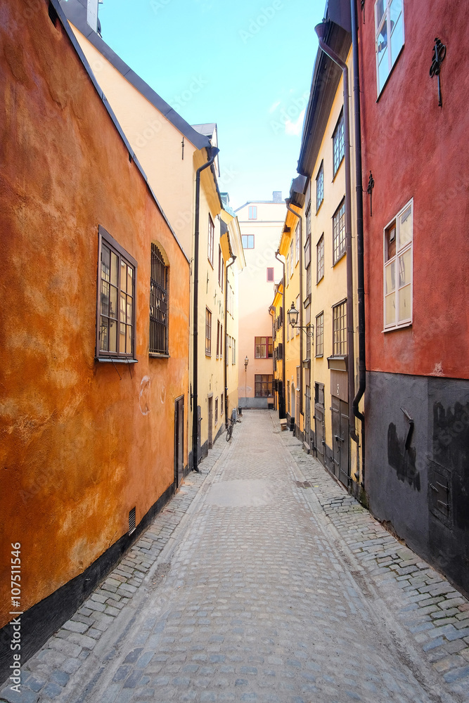 Obraz premium Stockholm, Sweden - March, 16, 2016: landscape with the image of Old Town street in Stockholm, Sweden