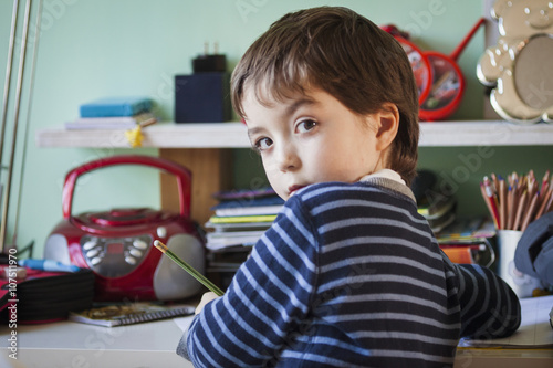 Boy doing homework at desk