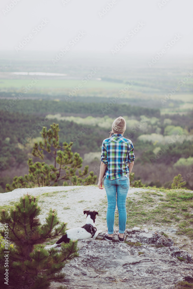 Fototapeta premium Woman and her dog posing outdoor. 