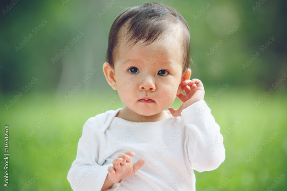 Baby happy in garden, new family and love concept (soft focus on Baby happy in garden, new family and love concept (soft focus on
