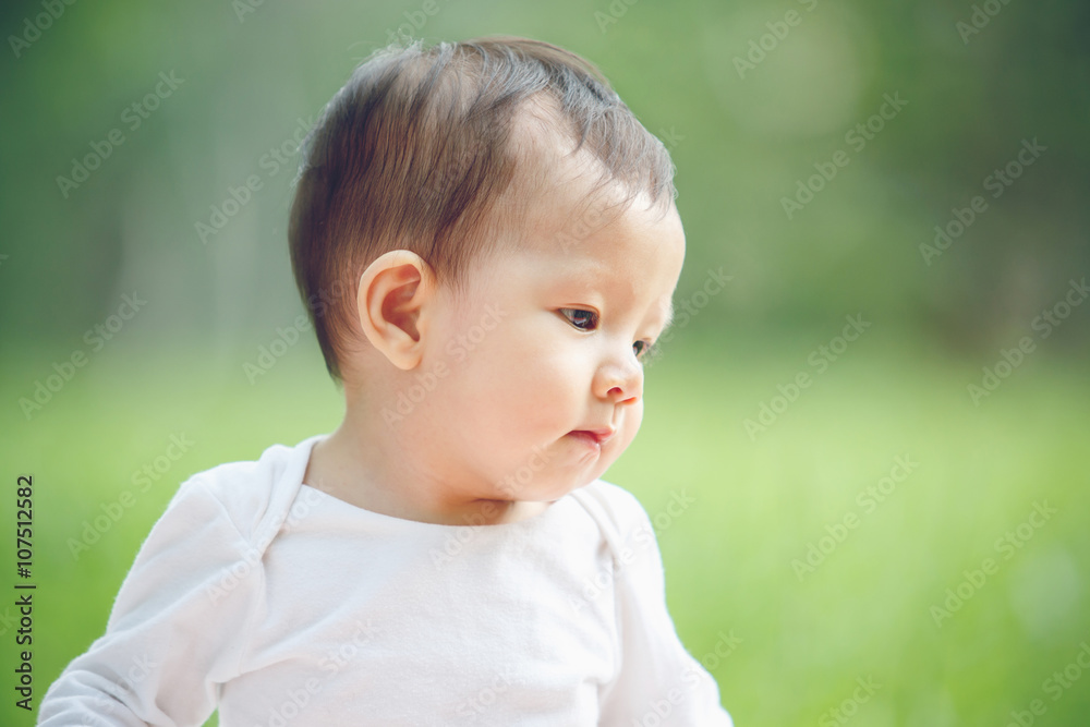 Asian child portrait in garden (soft focus on the eyes) Asian child portrait in garden (soft focus on the eyes)
