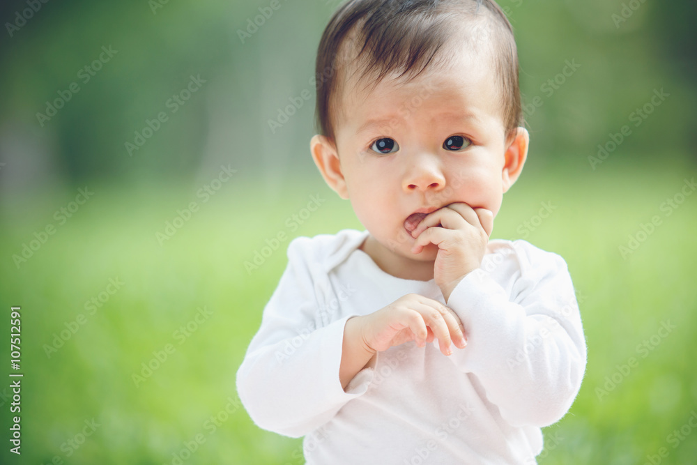 Baby happy in garden, new family and love concept (soft focus on Baby happy in garden, new family and love concept (soft focus on