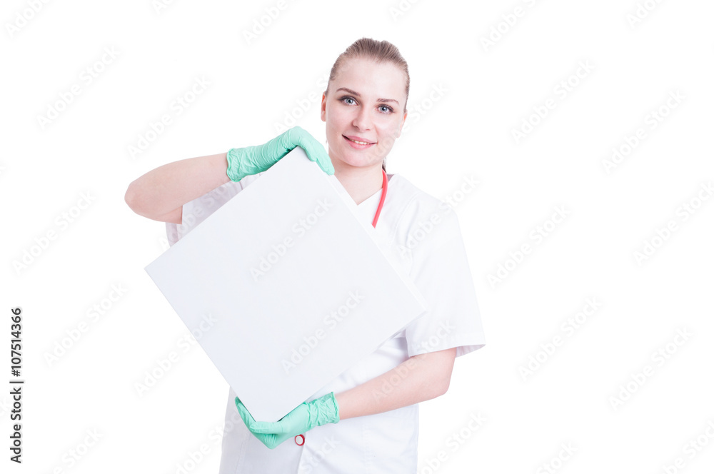Smiling young female doctor holding a box or package Smiling young female doctor holding a box or package