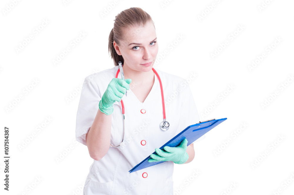 Serious woman doctor pointing at you with pen Serious woman doctor pointing at you with pen