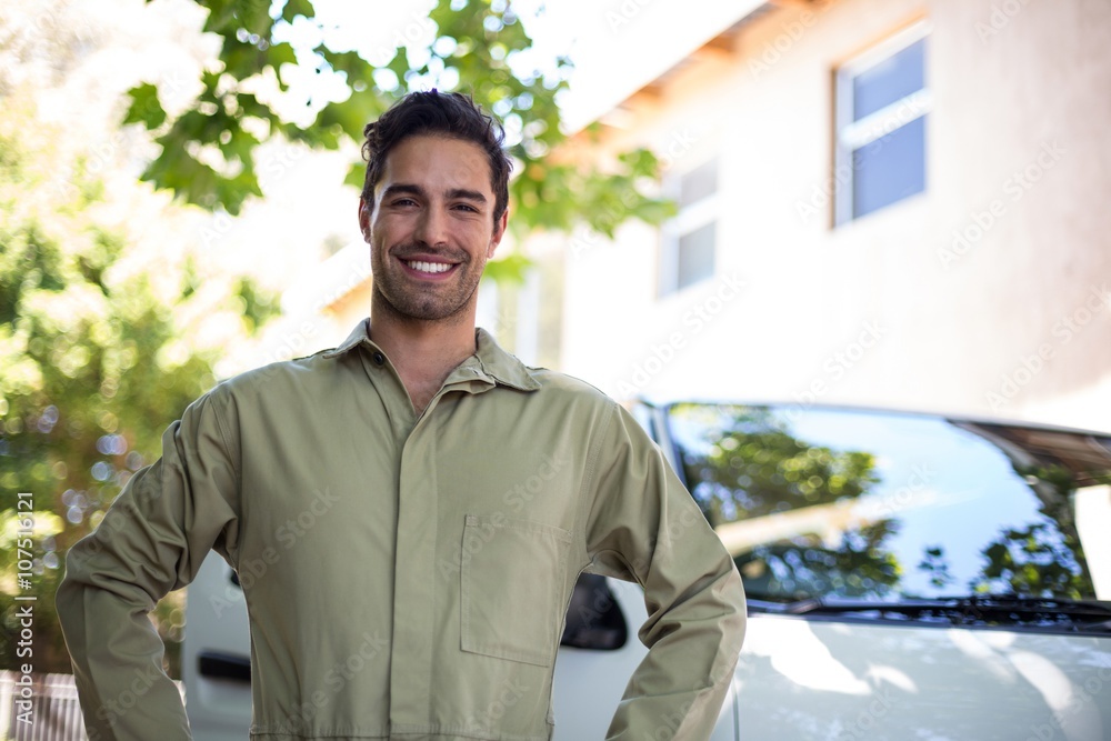 Portrait of smiling pesticide workerwith hand on hip Portrait of smiling pesticide workerwith hand on hip
