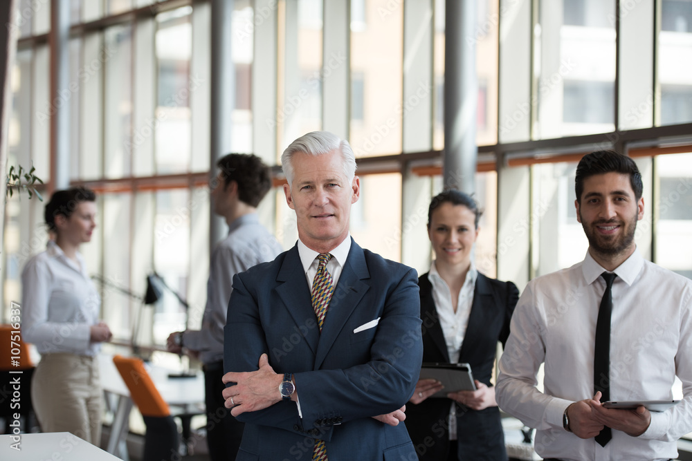 portrait of senior businessman as leader with group of people i portrait of senior businessman as leader with group of people i