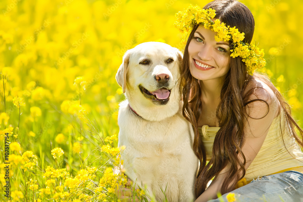 woman with labrador in a flowers field woman with labrador in a flowers field