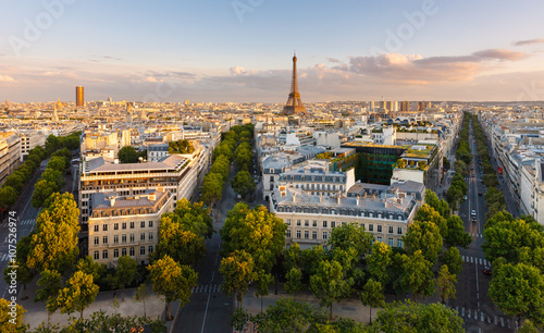 Paris from above showcasing rooftops  the Eiffel Tower  tree-lined avenues with haussmannian buildings lit by the setting sun. Avenue Kleber  Avenue d Iena and Avenue Marceau  16th arrondissement