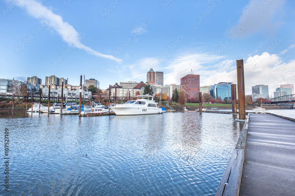 yacht on water with cityscape and skyline in portland