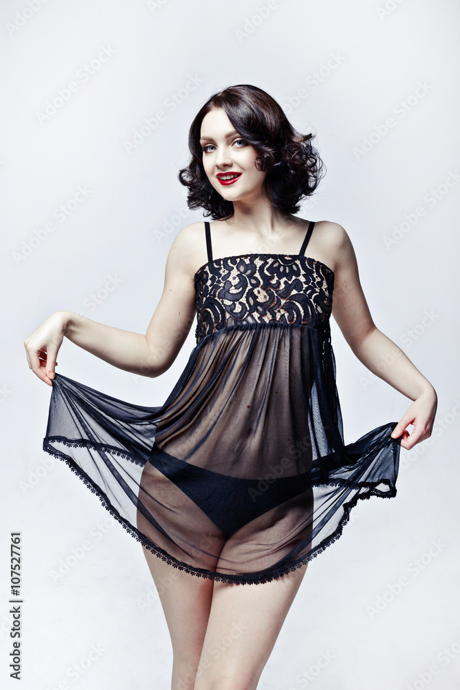 Young sexy slim tanned woman in luxury stylish black silk lingerie. Have perfect body, full red lips and middle length hair. Young sexy slim tanned woman in luxury stylish black silk lingerie. Have perfect body, full red lips and middle length hair.