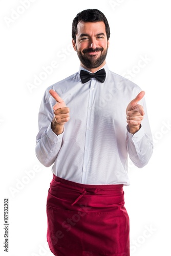 Waiter pointing to the front