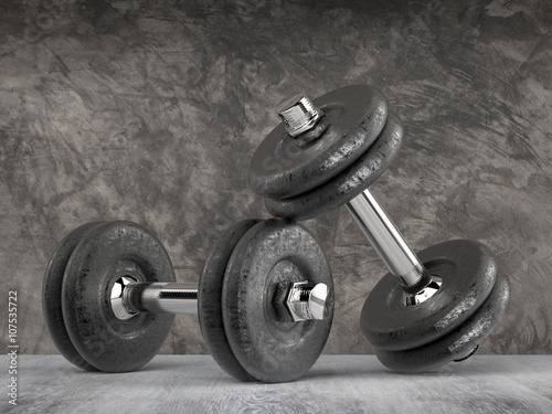 metal dumbbells with cement wall