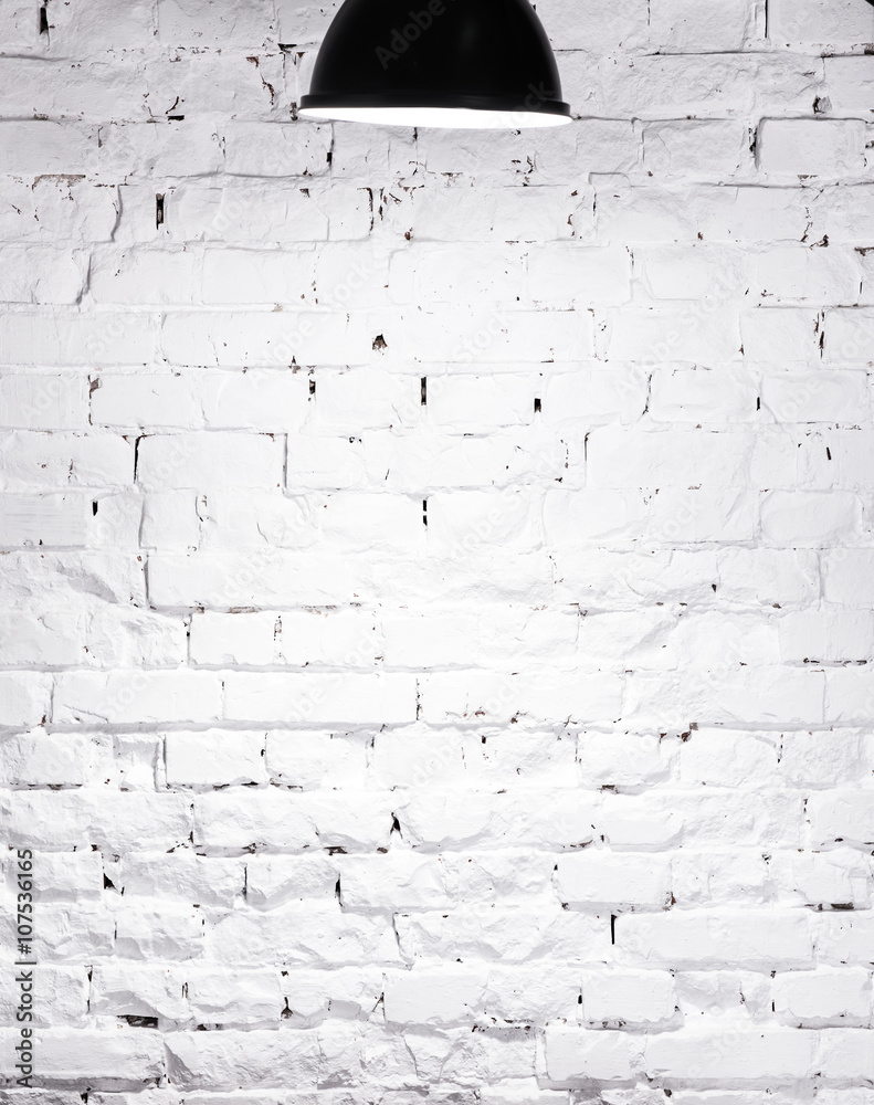 Fototapeta premium texture of brick whitewashed wall with lamp on top