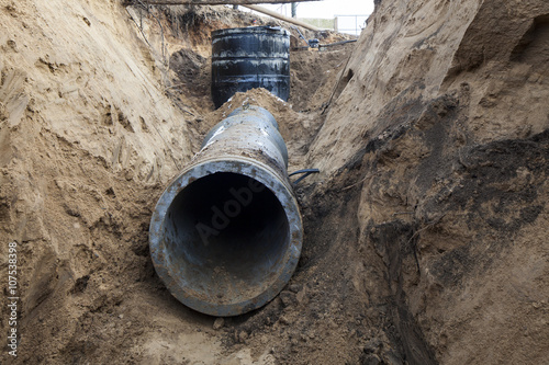 Fototapeta sewer pipe in the trench
