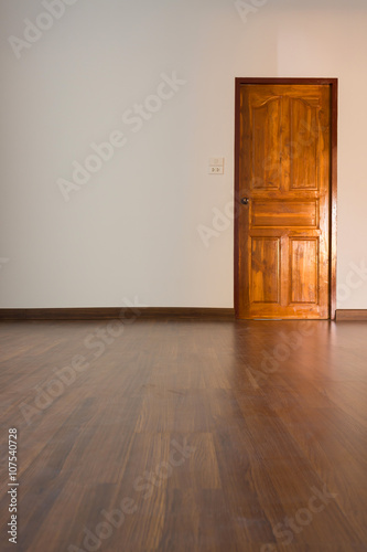 empty room  white mortar wall background and wood laminate floor