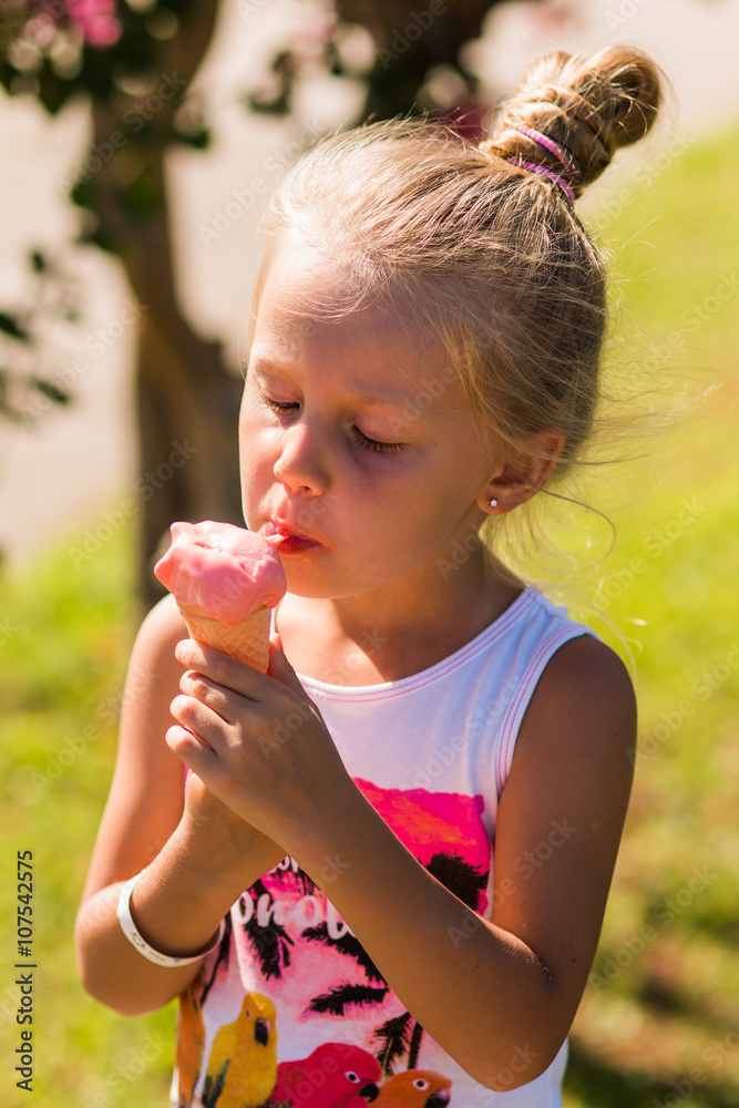 cute little girl eating ice cream in the summer sunny day
cute little girl eating ice cream in the summer sunny day